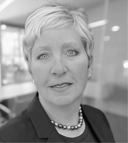 A black and white photo of a woman with short hair.