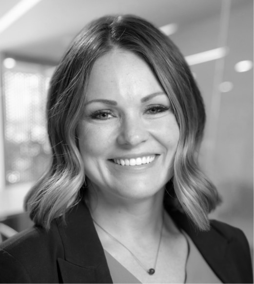A woman with long hair and a smile.