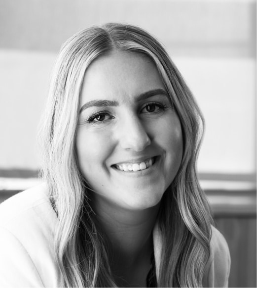 A woman with long hair smiling for the camera.