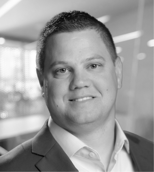 A black and white photo of a man in suit