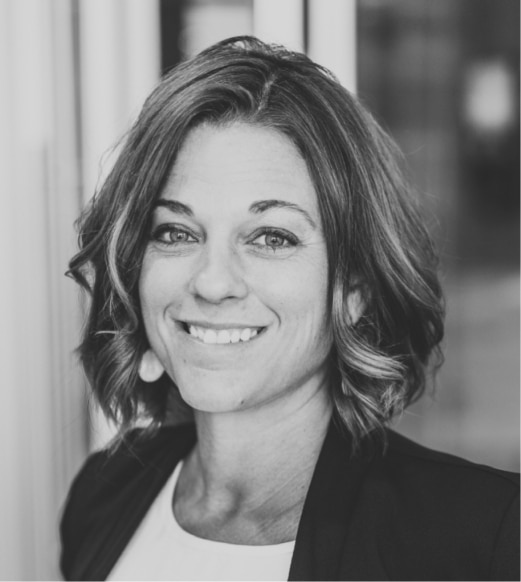 A woman with short hair is smiling for the camera.