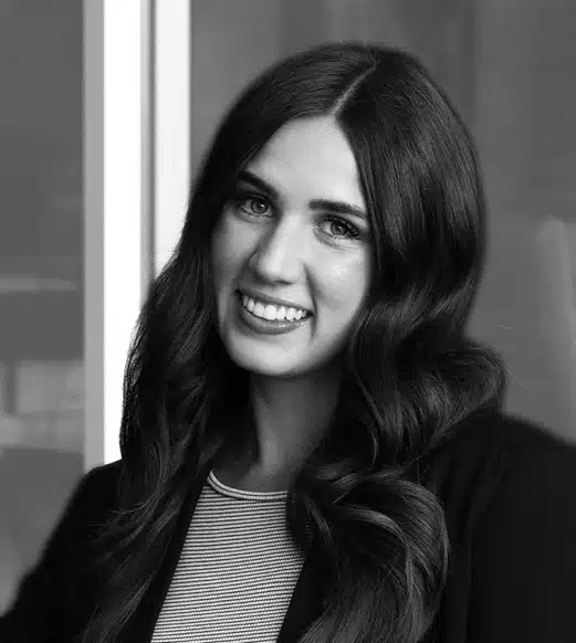 Smiling female headshot with long wavy hair